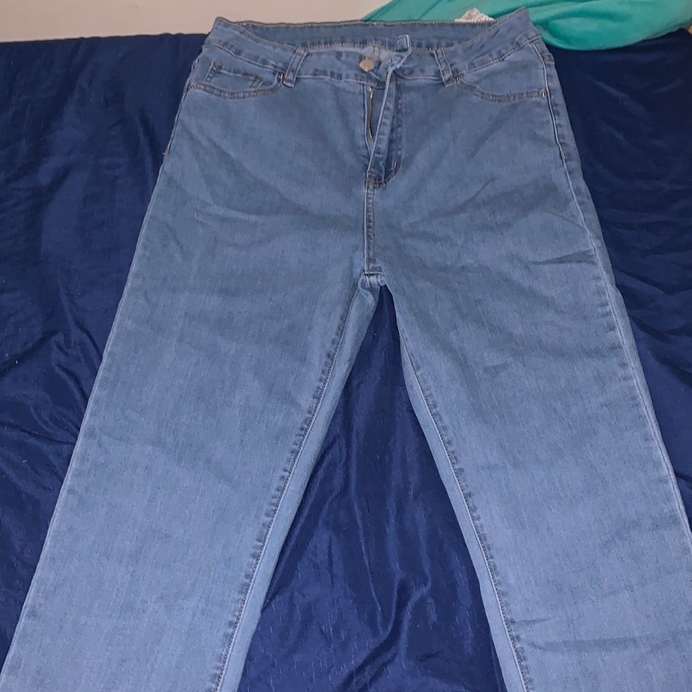 Long stacked blue jeans! We're too big for me never worn!!